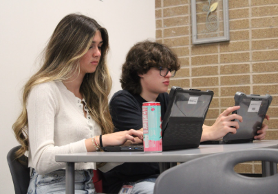 Senior Avery Massey and Senior Diego Prato Soto are doing work on their Chromebooks for class.
